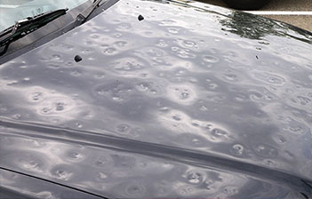 Mobile Paintless Dent Repair hail damage on car