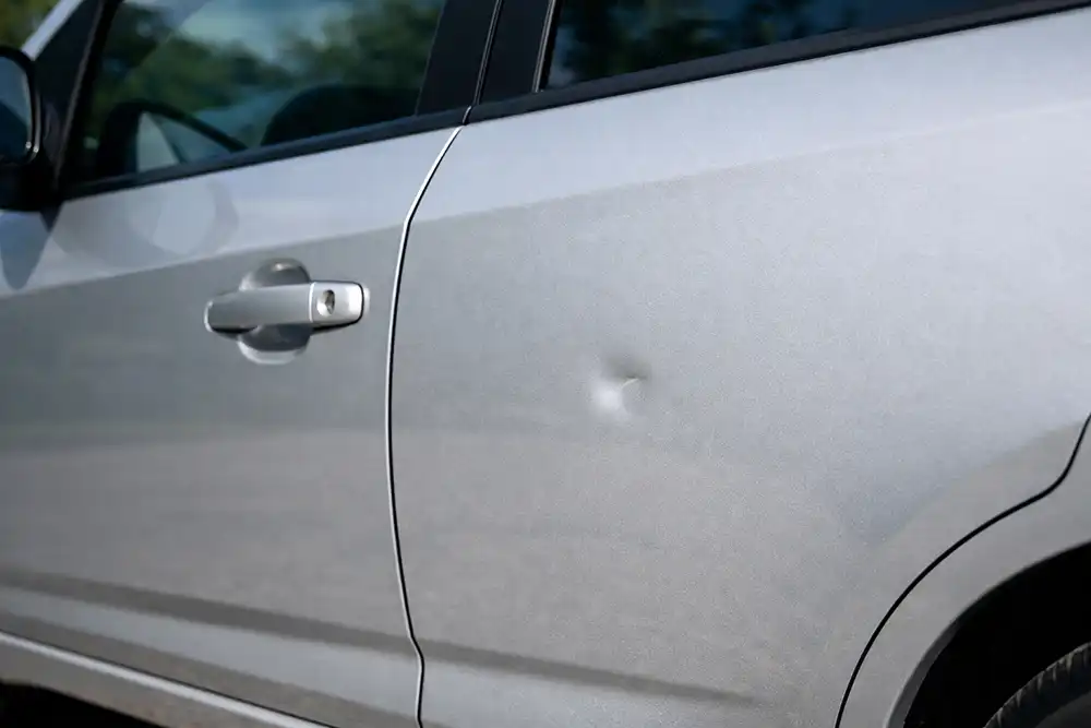 small door ding on vehicle before paintless dent repair
